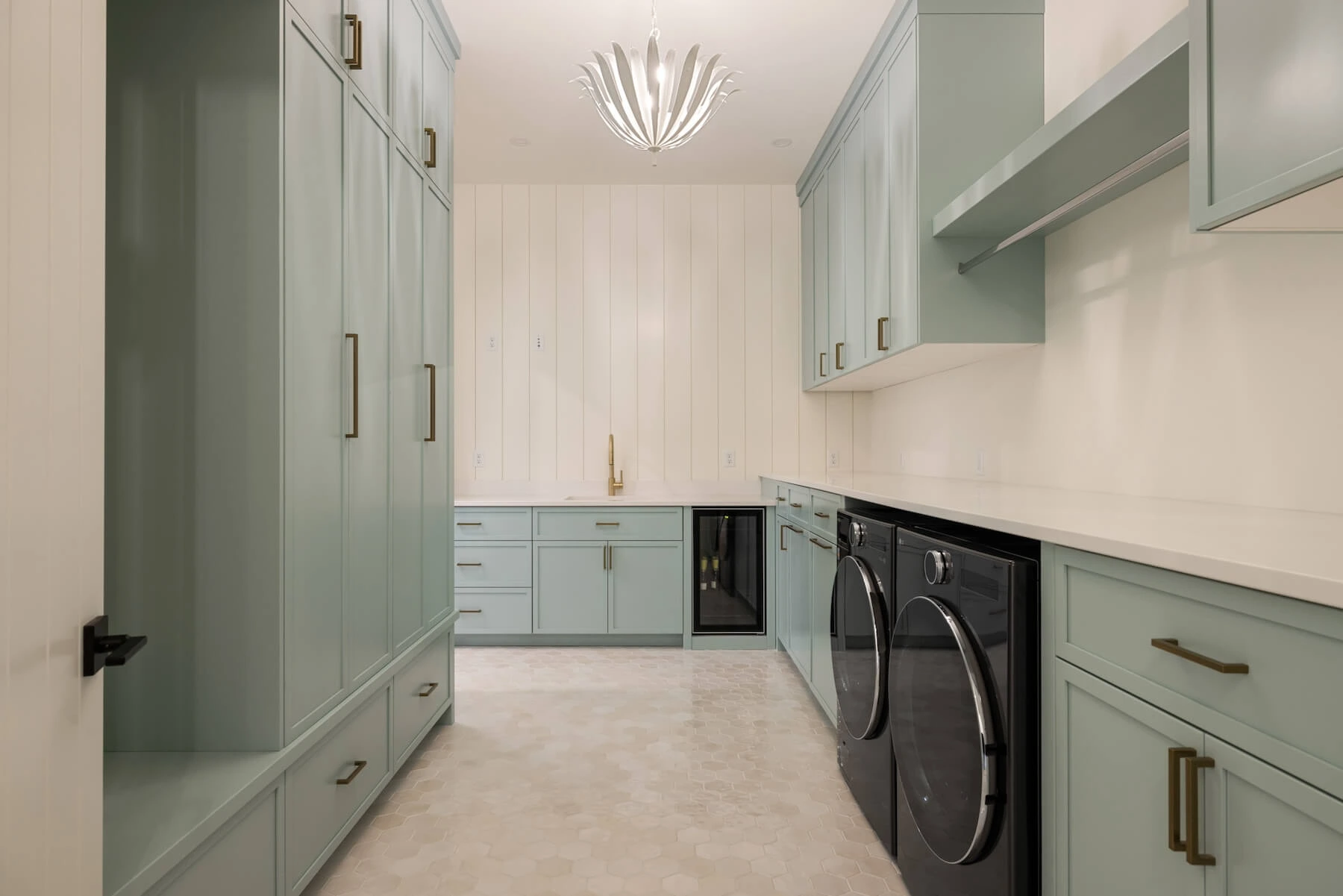 Custom home laundry room with teal accents