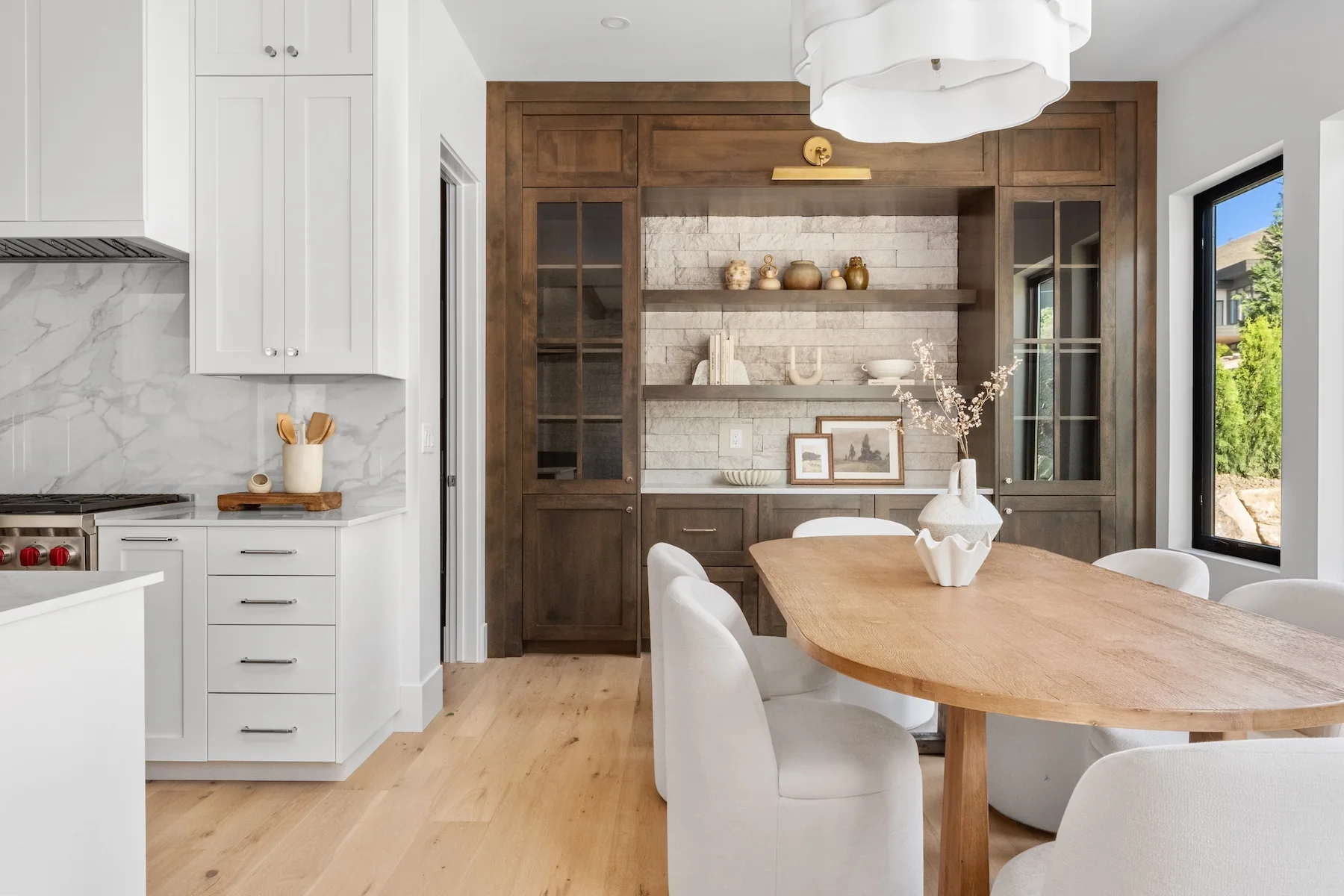 Dining room in luxury neighborhood with dark wood cabinets