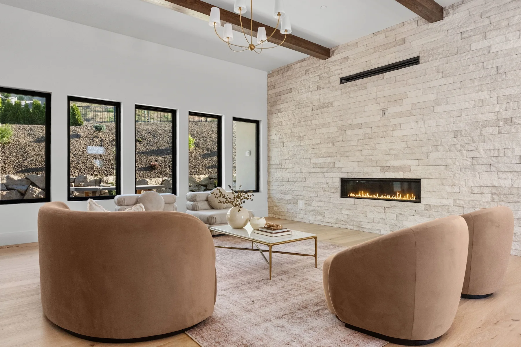 Clean modern living room with large windows