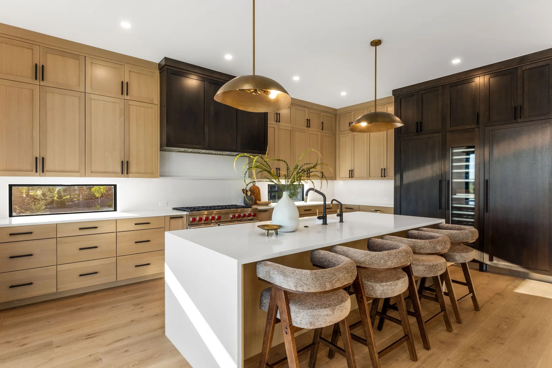 wood cabinets in a wood paneled kitchen with oak refrigerator